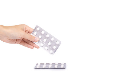 Medicine in tablet package in hand isolated on white background, pills in blister. copy space, template