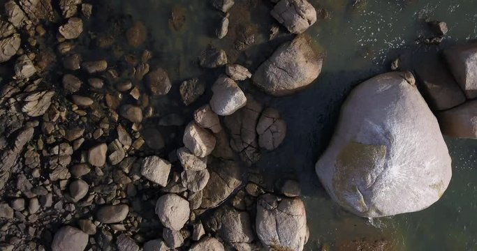 4K high quality aerial video footage of Western Cape's coast, Paternoster beach boulders, sandy sea front and Atlantic Ocean views in the background near Cape Town, South Africa on summer morning