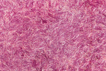 Colorful pink background of modern materials. background of threads