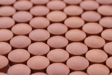 Red vitamin medication pil background