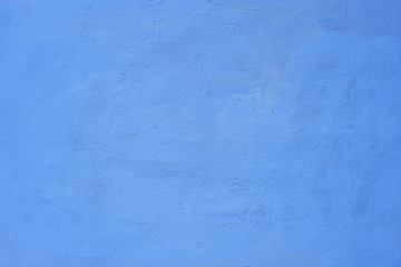 Background of a blue painted cement wall, rough cast of cement and concrete wall texture, decorative rustic coating