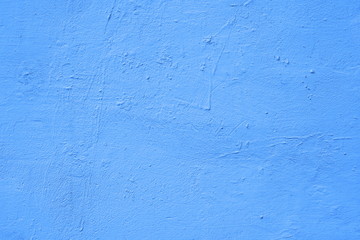 Background of a blue painted cement wall, rough cast of cement and concrete wall texture, decorative rustic coating