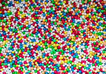 Round and Colorful Decorative Peas Surface Background