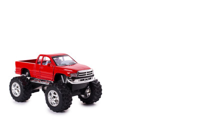 Obraz na płótnie Canvas big metal red toy car offroad with monster wheels isolated on white background. copy space, template