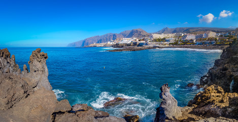 Puerto de Santiago city, Tenerife, Canary island, Spain: Beautiful view of Puerto de Santiago over the rocks and water
