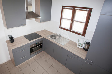 simple kitchen grey and wood with window