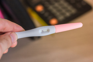 Pregnancy test in a human hand.