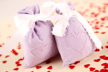 Closeup of two aroma bag with embroidered hearts
