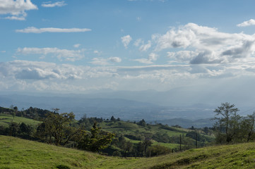 Fototapeta na wymiar Roling hills of Costa Rica on a Summer Day