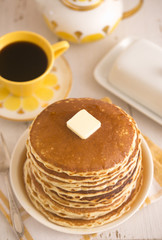 A Stack of Fresh Buttermilk Pancakes with Butter and Syrup