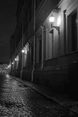 deserted ancient evening city street with paving stones
