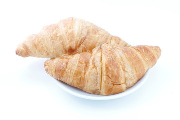 croissant, croissant bread on plate on white background (selective focus)