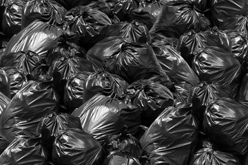 Fototapeta na wymiar Background garbage bag black bin, Garbage dump, Bin,Trash, Garbage, Rubbish, Plastic Bags pile junk garbage Trash texture
