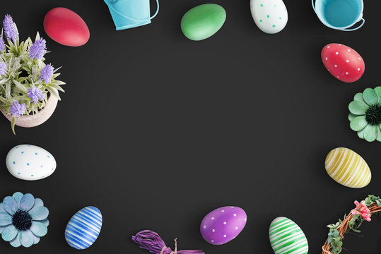 Easter background with colorful eggs on black background.
