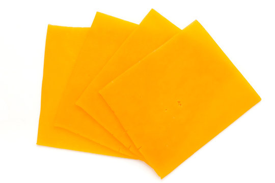 Cheddar cheese slice isolated on the white background.