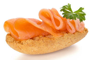 Bread with fresh salmon fillet isolated on white background, top view.