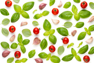 Basil and garlic isolated on white background, top view. Wallpaper abstract composition of vegetables.