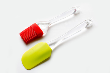 culinary spatula and brush on white background