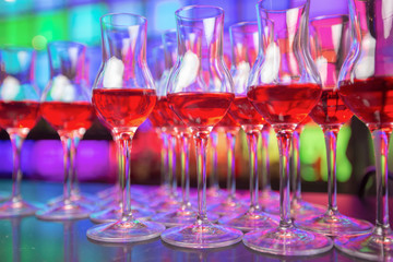 
Glass dishes in color lights background

