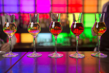 
Glass dishes in color lights background

