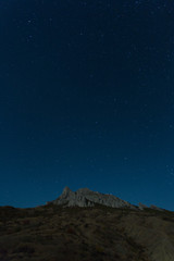 Rocks of the extinct volcano Karadag in the Crimea in night