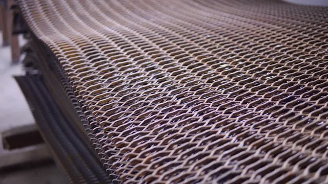 Stacked heavy rusty metal wire grid on a construction site