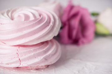 Raspberry meringue on concrete desk. Space for text. Close up view. Romatic wedding.