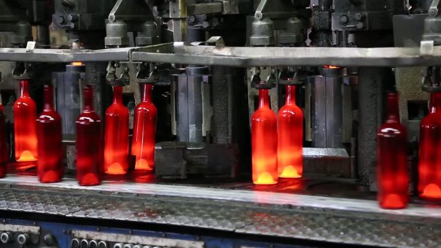 Production of glass bottles. Glass recycling. Bottle manufacturing industrial factory. Molten glass. Glass factory. Automated production line. Bottle manufacturing technology. Recycling. Ambient sound