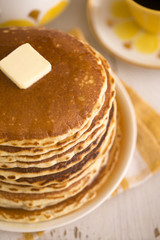 Fototapeta na wymiar A Stack of Fresh Buttermilk Pancakes with Butter and Syrup