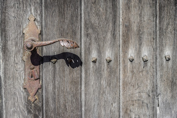 old wooden door close-up, rusty lock, concept , background