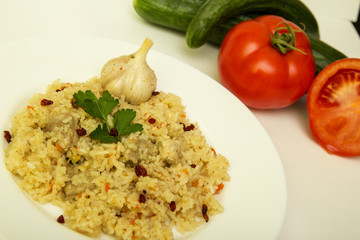 tasty plov rice and meat with vegetables