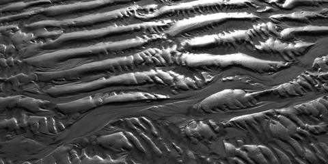 Foehr / Germany: Closeup of the texture of the dry fallen seabed in the Frisian Wadden Sea n the November sun