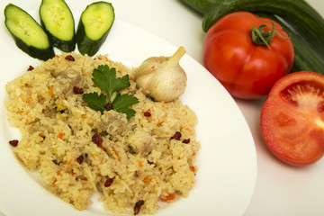 tasty plov rice and meat with vegetables