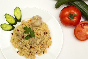 tasty plov rice and meat with vegetables
