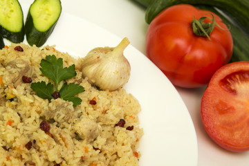 tasty plov rice and meat with vegetables