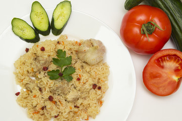 tasty plov rice and meat with vegetables