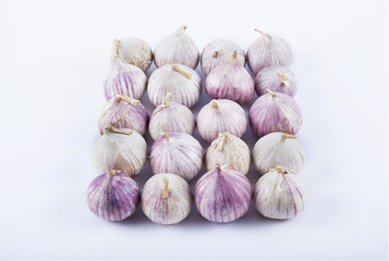 Small garlics on white background