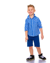 A cute little boy in a shirt and shorts.
