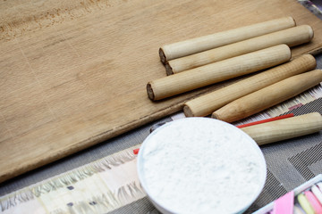 many culinary rolls for dough with grated cheese on the table