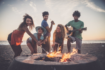 Friends partying on the beach