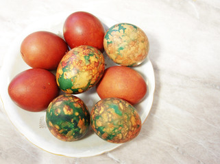 Colorful Easter Eggs On White Plate Placed By Heap