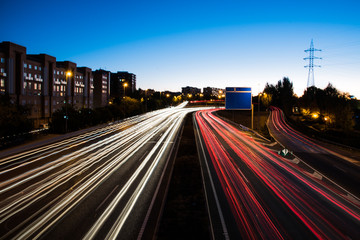 Car lights at night on busy city Road