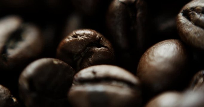 Closeup slow motion shot of roasted coffee beans