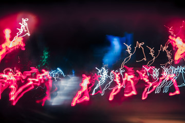 abstract background blurred colored marks from fast moving cars night