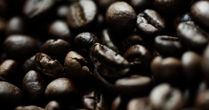 Closeup slow motion shot of roasted coffee beans