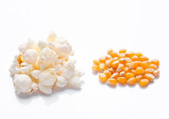 Raw golden sweet corn and popcorn seeds on white