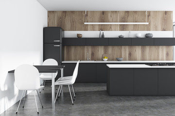 Wooden kitchen, black counters, bar