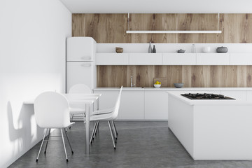 Wooden kitchen, white counters, table
