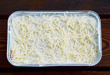 Uncooked Lasagne in aluminum foil box