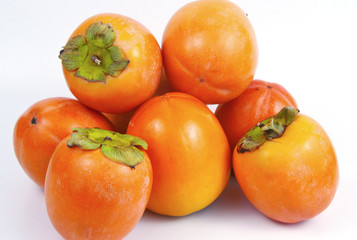 a lot of Diospyros kaki on white background